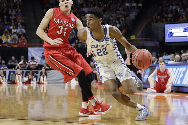 Kentucky guard Shai Gilgeous-Alexander (22) drives around Davidson guard Kellan Grady (31) during the second half of a first-round game in the NCAA men's college basketball tournament Thursday, March 15, 2018, in Boise, Idaho. Kentucky won 78-73. (AP Photo/Otto Kitsinger)