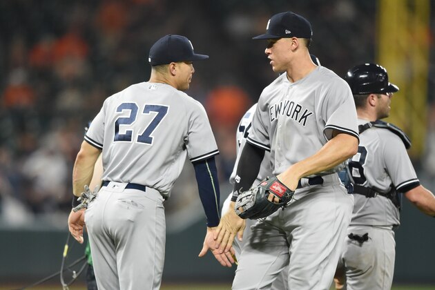 BALTIMORE, MD - JUNE 01:  Giancarlo Stanton #27 and Aaron Judge #99 of the New York Yankees celebrate a win against the Baltimore Orioles at Oriole Park at Camden Yards on June 1, 2018 in Baltimore, Maryland.  (Photo by Mitchell Layton/Getty Images)