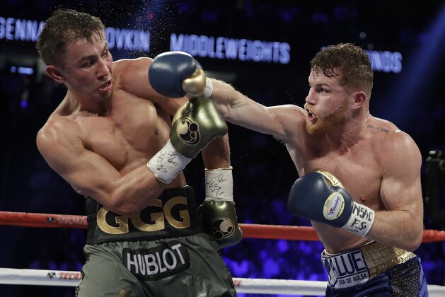 Canelo Alvarez, right, fights Gennady Golovkin during a middleweight title fight Saturday, Sept. 16, 2017, in Las Vegas. (AP Photo/John Locher)