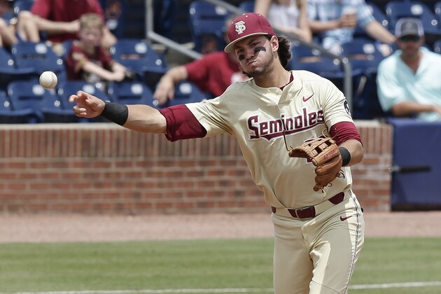 Florida State third baseman Drew Mendoza throws the ball to first base for an out during the second inning of an Atlantic Coast Conference NCAA college baseball tournament championship game against Louisville in Durham, N.C., Sunday, May 27, 2018. (AP Photo/Gerry Broome)