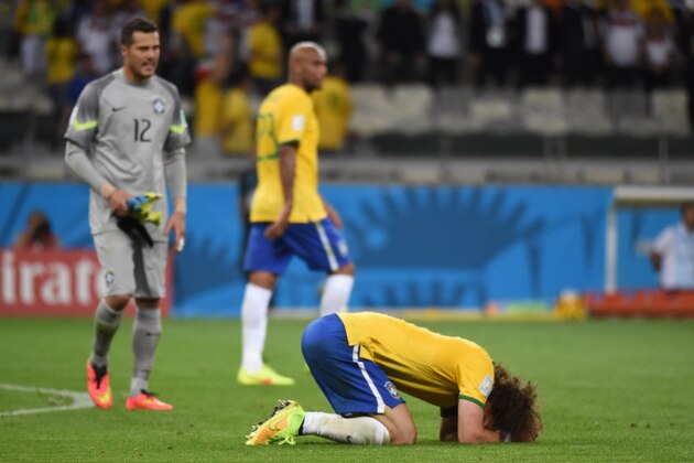 Brazil's defender David Luiz reacts after defeat in the semi-final football match between Brazil and Germany at The Mineirao Stadium in Belo Horizonte on July 8, 2014, during the 2014 FIFA World Cup.  AFP PHOTO / CHRISTOPHE SIMON        (Photo credit should read CHRISTOPHE SIMON/AFP/Getty Images)