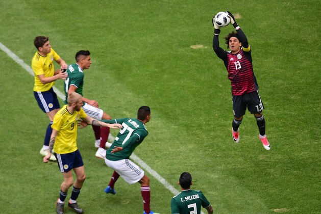 Mexico's goalkeeper Guillermo Ochoa grabs the ball during their international friendly football match against Scotland at the Azteca stadium in Mexico City, on June 2, 2018. (Photo by PEDRO PARDO / AFP)        (Photo credit should read PEDRO PARDO/AFP/Getty Images)