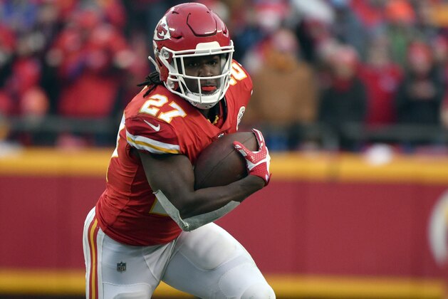 Kansas City Chiefs running back Kareem Hunt (27) carries the ball during the first half of an NFL wild-card playoff football game against the Tennessee Titans, in Kansas City, Mo., Saturday, Jan. 6, 2018. (AP Photo/Ed Zurga)