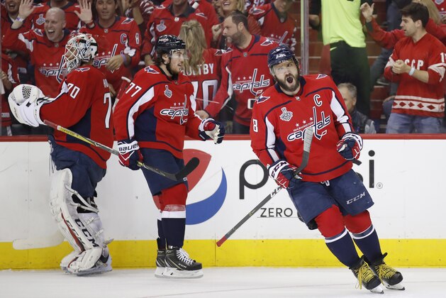Washington Capitals forward Alex Ovechkin, right, of Russia, celebrates a goal by T.J. Oshie (77) during the first period in Game 4 of the NHL hockey Stanley Cup Final against the Vegas Golden Knights, Monday, June 4, 2018, in Washington. (AP Photo/Alex Brandon)
