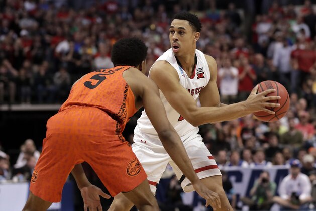 Florida's KeVaughn Allen (5) defends as Texas Tech guard Zhaire Smith (2) looks to make a pass during a second-round game at the NCAA men's college basketball tournament in Dallas, Saturday, March 17, 2018. (AP Photo/Tony Gutierrez)