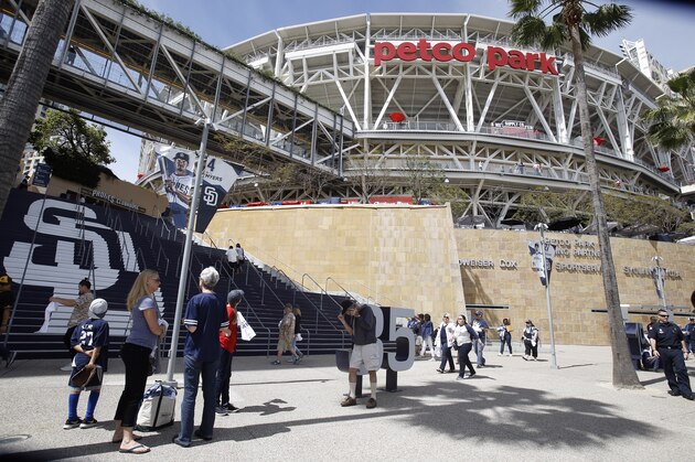 Fans enter PetCo Park before a baseball game between the San Diego Padres and San Francisco Giants in San Diego, Friday, April 7, 2017. (AP Photo/Alex Gallardo)