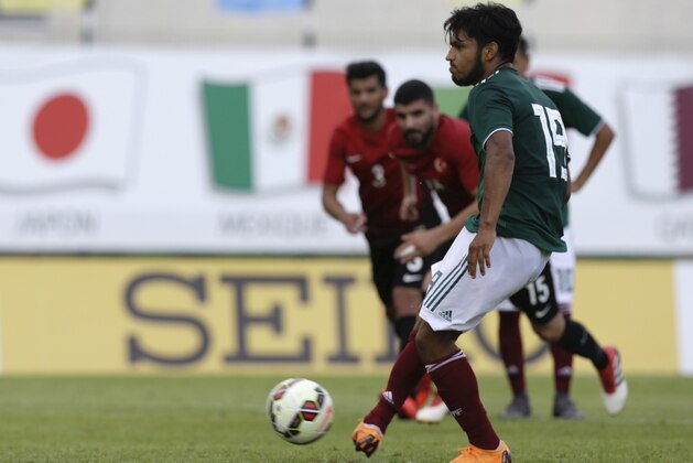 Mexico's Eduardo Daniel Aguirre Lara scores his third goals on a penalty , during the Under-21 Toulon soccer tournament match, between Mexico and Turkey, in Aubagne, southern France, Wednesday, June 6, 2018. (AP Photo/Claude Paris)