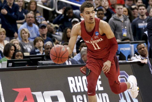Oklahoma's Trae Young brings the ball up court during overtime of an NCAA men's college basketball tournament first-round game against Rhode Island, Thursday, March 15, 2018, in Pittsburgh. (AP Photo/Keith Srakocic)