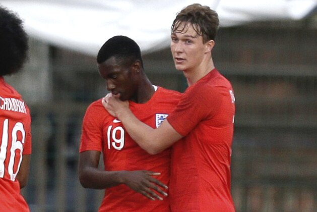 England's Edward Nketiah, right, celebrates with England's Kieran Dowell, after scoring during the Under-21 Toulon soccer tournament semifinal match, between England and Scotland, in Aubagne, southern France, Wednesday, June 6, 2018. (AP Photo/Claude Paris)