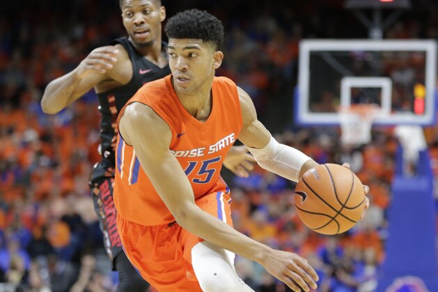 Boise State's Chandler Hutchison (15) moves the ball during the first half of an NCAA college basketball game against UNLV in Boise, Idaho, Saturday, Feb. 3, 2017. Boise State won 93-91 in overtime. (AP Photo/Otto Kitsinger)