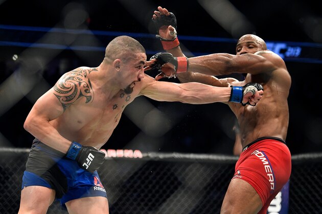 LAS VEGAS, NV - JULY 08:  (L-R) Robert Whittaker of New Zealand punches Yoel Romero of Cuba in their interim UFC middleweight championship bout during the UFC 213 event at the T-Mobile Arena on July 8, 2017 in Las Vegas, Nevada. (Photo by Jeff Bottari/Zuffa LLC/Zuffa LLC via Getty Images)