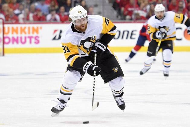 Pittsburgh Penguins right wing Phil Kessel (81) skates with the puck during the first period in Game 1 of an NHL second-round hockey playoff series against the Washington Capitals, Thursday, April 26, 2018, in Washington. (AP Photo/Nick Wass)
