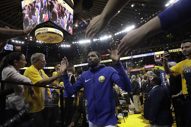 Fans cheer as Golden State Warriors forward Kevin Durant walks through a tunnel after Game 6 of the NBA basketball Western Conference Finals between the Warriors and the Houston Rockets in Oakland, Calif., Saturday, May 26, 2018. The Warriors won 115-86. (AP Photo/Marcio Jose Sanchez) Fans cheer as Golden State Warriors forward Kevin Durant walks through a tunnel after Game 6 of the NBA basketball Western Conference Finals between the Warriors and the Houston Rockets in Oakland, Calif., Saturday, May 26, 2018. The Warriors won 115-86. (AP Photo/Marcio Jose Sanchez)