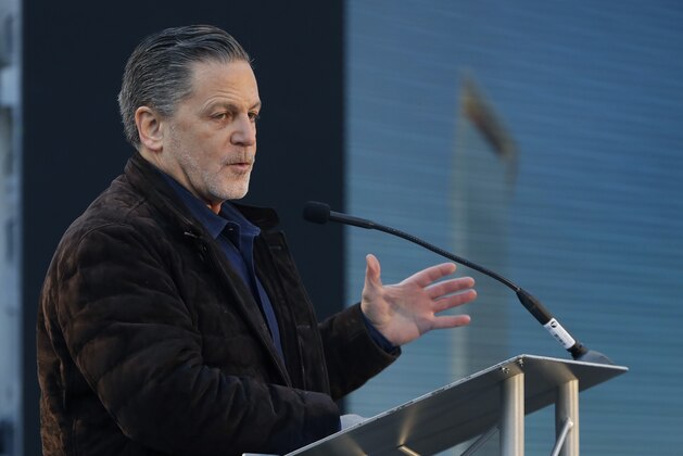 Quicken Loans founder Dan Gilbert, addresses attendees at the former site of the J.L. Hudson Co. department store, Thursday, Dec. 14, 2017, in Detroit. Ground was broken for a new 800-foot-tall, $900 million two-building project that will include a 58-story residential tower and 12-floor building for retail and conference space. The tower will have an 800-foot-tall (244-meter) sky deck.(AP Photo/Carlos Osorio)