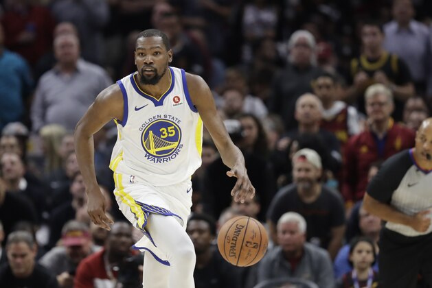 Golden State Warriors' Kevin Durant dribbles in the first half of Game 3 of basketball's NBA Finals against the Cleveland Cavaliers, Wednesday, June 6, 2018, in Cleveland. (AP Photo/Tony Dejak)