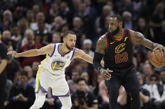 Cleveland Cavaliers' LeBron James is defended by Golden State Warriors' Stephen Curry in the first half of Game 3 of basketball's NBA Finals, Wednesday, June 6, 2018, in Cleveland. (AP Photo/Tony Dejak)