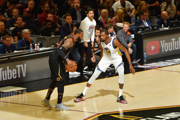 CLEVELAND, OH - JUNE 6:  LeBron James #23 of the Cleveland Cavaliers handles the ball against Kevin Durant #35 of the Golden State Warriors in Game Three of the 2018 NBA Finals on June 6, 2018 at Quicken Loans Arena in Cleveland, Ohio. NOTE TO USER: User expressly acknowledges and agrees that, by downloading and/or using this Photograph, user is consenting to the terms and conditions of the Getty Images License Agreement. Mandatory Copyright Notice: Copyright 2018 NBAE (Photo by Jesse D. Garrabrant/NBAE via Getty Images)