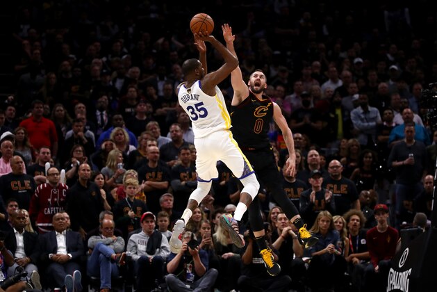 CLEVELAND, OH - JUNE 06:  Kevin Durant #35 of the Golden State Warriors attempts a jumper over Kevin Love #0 of the Cleveland Cavaliers in the second half during Game Three of the 2018 NBA Finals at Quicken Loans Arena on June 6, 2018 in Cleveland, Ohio. NOTE TO USER: User expressly acknowledges and agrees that, by downloading and or using this photograph, User is consenting to the terms and conditions of the Getty Images License Agreement.  (Photo by Gregory Shamus/Getty Images)