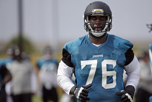 Jacksonville Jaguars offensive lineman Branden Albert warms up during NFL football training camp, Thursday, July 27, 2017, in Jacksonville, Fla. (AP Photo/John Raoux)