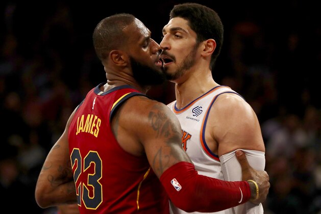 NEW YORK, NY - NOVEMBER 13:  LeBron James #23 of the Cleveland Cavaliers and Enes Kanter #00 of the New York Knicks exchange words in the first half at Madison Square Garden on November 13, 2017 in New York City. NOTE TO USER: User expressly acknowledges and agrees that, by downloading and or using this Photograph, user is consenting to the terms and conditions of the Getty Images License Agreement  (Photo by Elsa/Getty Images)