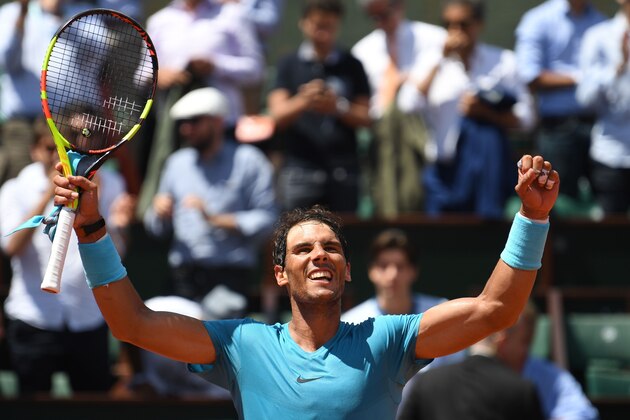 Spain's Rafael Nadal celebrates after victory over  Argentina's Diego Schwartzman during their men's singles quarter-final match on day twelve of The Roland Garros 2018 French Open tennis tournament in Paris on June 7, 2018. (Photo by Eric FEFERBERG / AFP)        (Photo credit should read ERIC FEFERBERG/AFP/Getty Images)