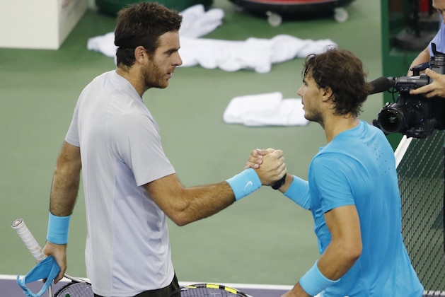 Juan Martin del Potro of Argentina, left, and Rafael Nadal of Spain shake hands after their singles semifinal match of the Shanghai Masters tennis tournament at Qizhong Forest Sports City Tennis Center, in Shanghai, China, Saturday, Oct. 12, 2013. Del Potro won 6-2, 6-4. (AP Photo/Eugene Hoshiko)