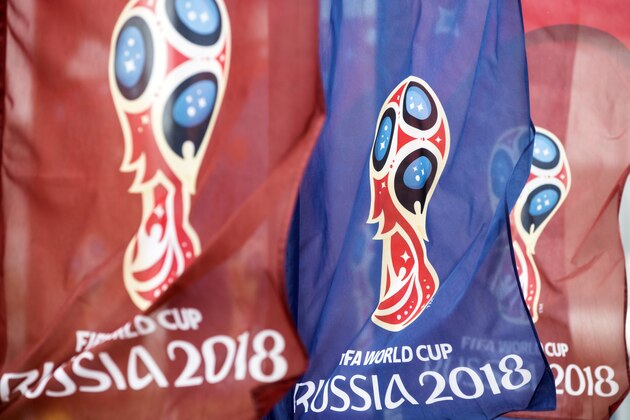 Flags with the logo for the 2018 FIFA World Cup flutter in the wind near the World Cup stadium in Rostov-on-Don before the Russian premier league soccer match between Rostov and Ural, in Rostov-on-Don, Russia, Sunday, May 13, 2018. (AP Photo/Pavel Golovkin)