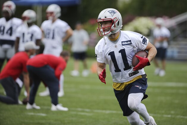 New England Patriots wide receiver Julian Edelman (11) runs with the ball during an NFL football minicamp practice, Wednesday, June 6, 2018, in Foxborough, Mass. (AP Photo/Elise Amendola)