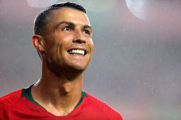 Portuguese captain Cristiano Ronaldo smiles during the friendly football match between Portugal and Algeria, on June 7, 2018 at the Luz stadium  in Lisbon. (Photo by JOSE MANUEL RIBEIRO / AFP)        (Photo credit should read JOSE MANUEL RIBEIRO/AFP/Getty Images)