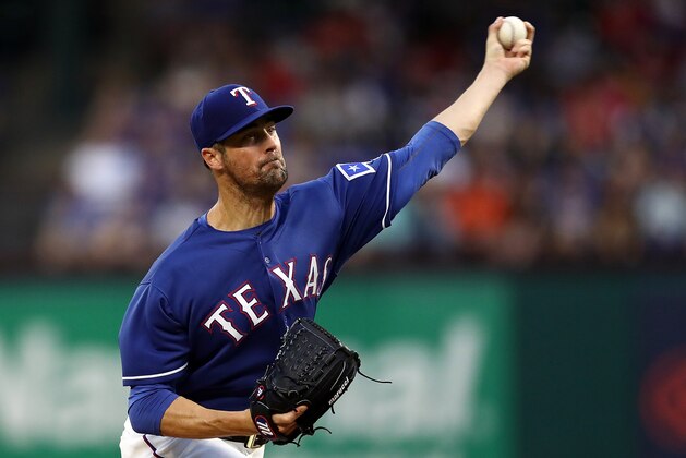 ARLINGTON, TX - JUNE 07:  Cole Hamels #35 of the Texas Rangers throws against the Houston Astros in the second inning at Globe Life Park in Arlington on June 7, 2018 in Arlington, Texas.  (Photo by Ronald Martinez/Getty Images)