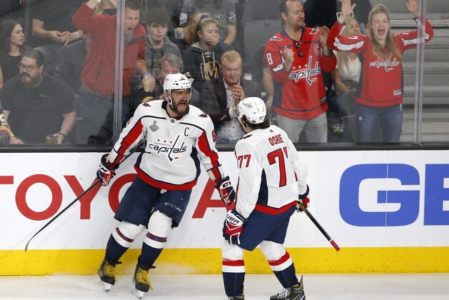 Washington Capitals left wing Alex Ovechkin, left, of Russia, celebrates his goal with right wing T.J. Oshie during the second period in Game 5 of the NHL hockey Stanley Cup Finals against the Vegas Golden Knights on Thursday, June 7, 2018, in Las Vegas. (AP Photo/Ross D. Franklin)