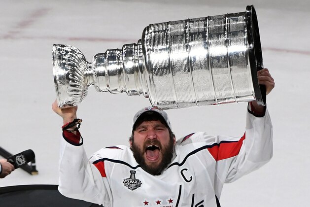 LAS VEGAS, NV - JUNE 07:  Alex Ovechkin #8 of the Washington Capitals hoists the Stanley Cup after the team's 4-3 win over the Vegas Golden Knights in Game Five of the 2018 NHL Stanley Cup Final at T-Mobile Arena on June 7, 2018 in Las Vegas, Nevada.  (Photo by Ethan Miller/Getty Images)