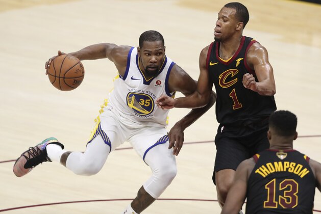 Golden State Warriors' Kevin Durant goes to the basket against Cleveland Cavaliers' Rodney Hood in the second half of Game 3 of basketball's NBA Finals, Wednesday, June 6, 2018, in Cleveland. The Warriors defeated the Cavaliers 110-102 to take a 3-0 lead in the series. (AP Photo/Carlos Osorio)