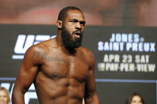 Jon Jones reacts on the scale during a weigh-in for UFC 197, Friday, April 22, 2016, in Las Vegas. Jones is scheduled to fight Ovince Saint Preux in an interim light heavyweight title bout Saturday in Las Vegas.(AP Photo/John Locher)