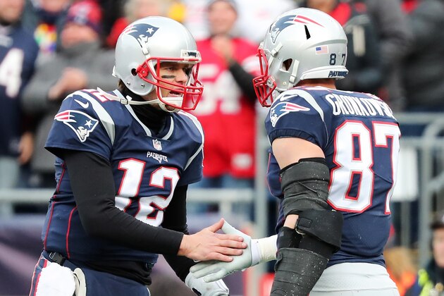FOXBORO, MA - DECEMBER 24:  Rob Gronkowski #87 of the New England Patriots reacts with Tom Brady #12 after catching a touchdown pass during the second quarter of a game against the Buffalo Bills at Gillette Stadium on December 24, 2017 in Foxboro, Massachusetts.  (Photo by Adam Glanzman/Getty Images)