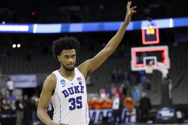 Duke's Marvin Bagley III celebrates as he heads off the court following a regional semifinal game against Syracuse in the NCAA men's college basketball tournament Friday, March 23, 2018, in Omaha, Neb. Duke won 69-65. (AP Photo/Nati Harnik)
