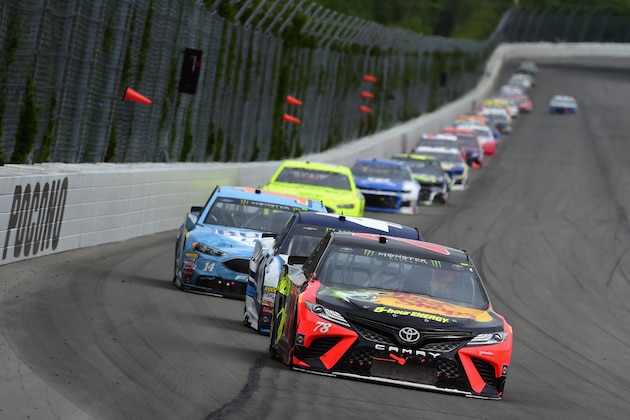 LONG POND, PA - JUNE 03: Martin Truex Jr., driver of the #78 Bass Pro Shops/5-hour ENERGY Toyota, leads a pack of cars during the Monster Energy NASCAR Cup Series Pocono 400 at Pocono Raceway on June 3, 2018 in Long Pond, Pennsylvania.  (Photo by Jared C. Tilton/Getty Images)