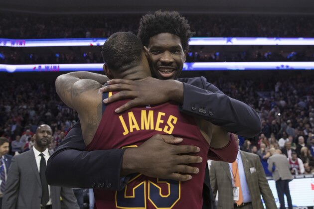 PHILADELPHIA, PA - APRIL 6: LeBron James #23 of the Cleveland Cavaliers hugs Joel Embiid #21 of the Philadelphia 76ers after the game at the Wells Fargo Center on April 6, 2018 in Philadelphia, Pennsylvania. The 76ers defeated the Cavaliers 132-130. NOTE TO USER: User expressly acknowledges and agrees that, by downloading and or using this photograph, User is consenting to the terms and conditions of the Getty Images License Agreement. (Photo by Mitchell Leff/Getty Images)