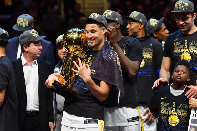 CLEVELAND, OH - JUNE 8: Klay Thompson #11 of the Golden State Warriors holds the Larry O'Brien Championship trophy after defeating the Cleveland Cavaliers in Game Four of the 2018 NBA Finals on June 8, 2018 at Quicken Loans Arena in Cleveland, Ohio. NOTE TO USER: User expressly acknowledges and agrees that, by downloading and/or using this Photograph, user is consenting to the terms and conditions of the Getty Images License Agreement. Mandatory Copyright Notice: Copyright 2018 NBAE (Photo by Jesse D. Garrabrant/NBAE via Getty Images)