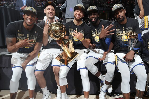 CLEVELAND, OH - JUNE 8: Andre Iguodala #9, Klay Thompson #11, Stephen Curry #30, Draymond Green #23, and Kevin Durant #35 of the Golden State Warriors pose with the Larry O'Brien Championship Trophy after Game Four of the 2018 NBA Finals against the Cleveland Cavaliers on June 8, 2018 at Quicken Loans Arena in Cleveland, Ohio. NOTE TO USER: User expressly acknowledges and agrees that, by downloading and/or using this photograph, user is consenting to the terms and conditions of the Getty Images License Agreement. Mandatory Copyright Notice: Copyright 2018 NBAE (Photo by Nathaniel S. Butler/NBAE via Getty Images)