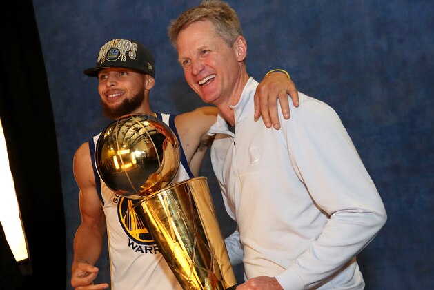 CLEVELAND,OH - Stephen Curry #30 and Head Coach Steve Kerr of the Golden State Warriors pose for a portrait with the Larry O'Brien Championship trophy after defeating the Cleveland Cavaliers in Game Four of the 2018 NBA Finals on June 8, 2018 at Quicken Loans Arena in Cleveland, Ohio. NOTE TO USER: User expressly acknowledges and agrees that, by downloading and/or using this photograph, user is consenting to the terms and conditions of the Getty Images License Agreement. Mandatory Copyright Notice: Copyright 2018 NBAE (Photo by Joe Murphy/NBAE via Getty Images)