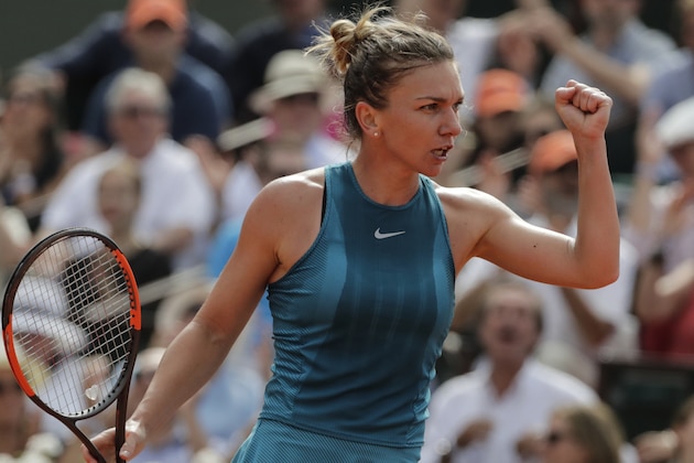 Romania's Simona Halep reacts during her  women's singles final match against Sloane Stephens of the US, on day fourteen of The Roland Garros 2018 French Open tennis tournament in Paris on June 9, 2018. (Photo by Thomas SAMSON / AFP)        (Photo credit should read THOMAS SAMSON/AFP/Getty Images)