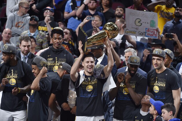 CLEVELAND,OH - Klay Thompson #11 of the Golden State Warriors celebrates after the game against the Cleveland Cavaliers while holding the Larry O'Brien NBA Championship Trophy after Game Four of the 2018 NBA Finals on June 8, 2018 at Quicken Loans Arena in Cleveland, Ohio. NOTE TO USER: User expressly acknowledges and agrees that, by downloading and/or using this photograph, user is consenting to the terms and conditions of the Getty Images License Agreement. Mandatory Copyright Notice: Copyright 2018 NBAE (Photo by David Liam Kyle/NBAE via Getty Images)