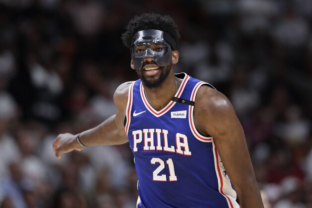 Philadelphia 76ers' Joel Embiid (21) reacts after shooting a three point basket during the second half of Game 3 of a first-round NBA basketball playoff series against the Miami Heat, Thursday, April 19, 2018, in Miami. The 76ers won 128-108. (AP Photo/Lynne Sladky)