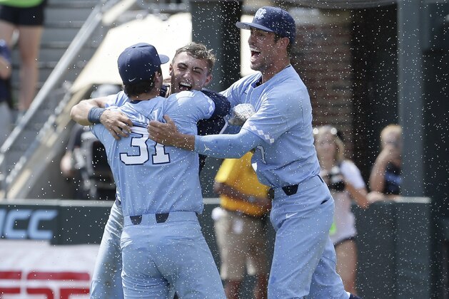 North Carolina pitcher Josh Hiatt (31) hugs catcher Brandon Martorano as infielder Dallas Tessar (7) celebrates following the team's win over Stetson following an NCAA super regional college baseball game in Chapel Hill, N.C., Saturday, June 9, 2018. North Carolina won 7-5 to advance to the College World Series. (AP Photo/Gerry Broome) North Carolina pitcher Josh Hiatt (31) hugs catcher Brandon Martorano as infielder Dallas Tessar (7) celebrates following the team's win over Stetson following an NCAA super regional college baseball game in Chapel Hill, N.C., Saturday, June 9, 2018. North Carolina won 7-5 to advance to the College World Series. (AP Photo/Gerry Broome)