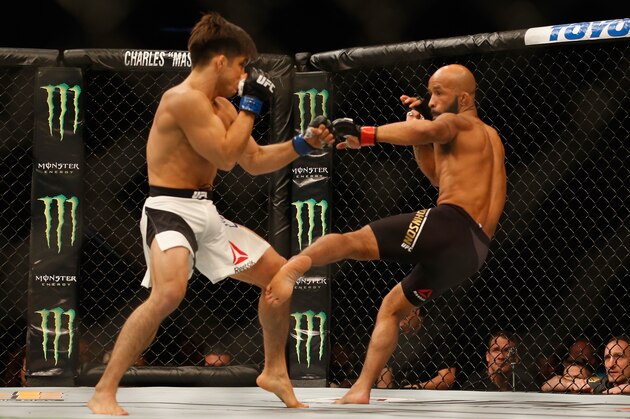 LAS VEGAS, NV - APRIL 23:  (R-L) Demetrious Johnson kicks Henry Cejudo in their flyweight championship bout during the UFC 197 event inside MGM Grand Garden Arena on April 23, 2016 in Las Vegas, Nevada.  (Photo by Christian Petersen/Zuffa LLC/Zuffa LLC via Getty Images)