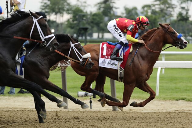 Justify (1), with jockey Mike Smith up, leads early out of the starting gate during the 150th running of the Belmont Stakes horse race, Saturday, June 9, 2018, in Elmont, N.Y. (AP Photo/Frank Franklin II)