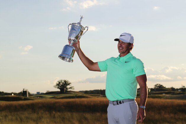 HARTFORD, WI - JUNE 18:  Brooks Koepka of the United States poses with the winner's trophy after his victory at the 2017 U.S. Open at Erin Hills on June 18, 2017 in Hartford, Wisconsin.  (Photo by Streeter Lecka/Getty Images)