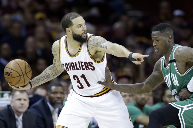 Cleveland Cavaliers' Deron Williams (31) looks to get around Boston Celtics' Terry Rozier (12) during the first half of Game 4 of the NBA basketball Eastern Conference finals, Tuesday, May 23, 2017, in Cleveland. (AP Photo/Tony Dejak)