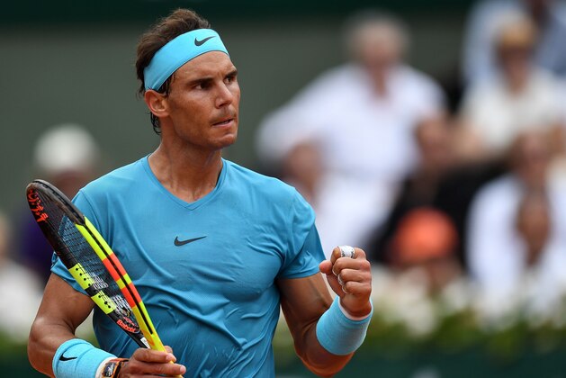 Spain's Rafael Nadal reacts during his men's singles final match against Austria's Dominic Thiem, on day fifteen of The Roland Garros 2018 French Open tennis tournament in Paris on June 10, 2018. (Photo by Christophe ARCHAMBAULT / AFP)        (Photo credit should read CHRISTOPHE ARCHAMBAULT/AFP/Getty Images)